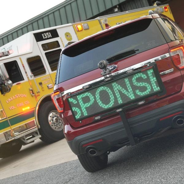 An Emergency Assistance LED Display Installed at the Rear of a Vehicle