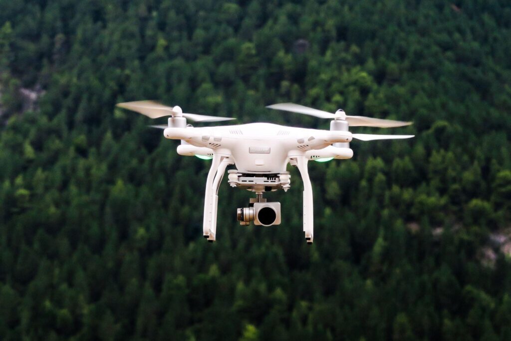 A security system drone camera flying in trees
