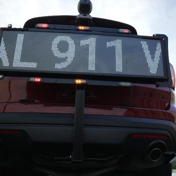  An LED safety sign attached on the back of a vehicle